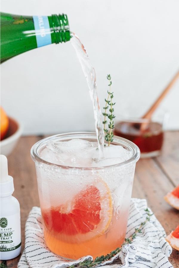 This Grapefruit, Thyme and CBD mocktail is a fun, light, refreshing, immune-boosting drink to take advantage of citrus season and uplift your spirits this winter!
